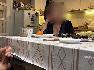 husband jerking under table in kitchen with step mom watching