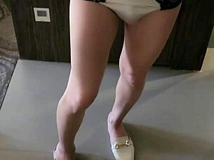 This ladyboy teases and flirts shamelessly in front of the mirror. Every angle is pure seduction.