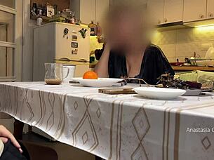 husband jerking under table in kitchen with step mom watching