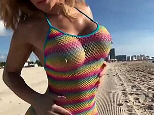 Beautiful blonde milf enjoys the beach with her big tits and ass.