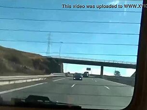 Young adult engages in solo play with toys in car