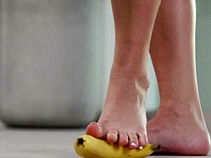 brunette crushes fruits with bare feet and heels in footfetish video