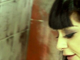 Goth Mai Bailey bends over for glory hole action