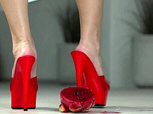 brunette crushes fruits with bare feet and heels in footfetish video