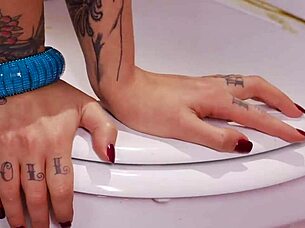 Goth Mai Bailey bends over for glory hole action