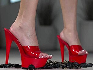 brunette crushes fruits with bare feet and heels in footfetish video