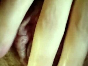 Milf shows off her wet hairy pussy in bedroom