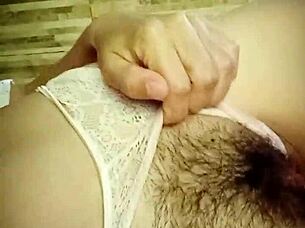 Milf shows off her wet hairy pussy in bedroom