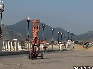 Milf wife rides naked in public flashing