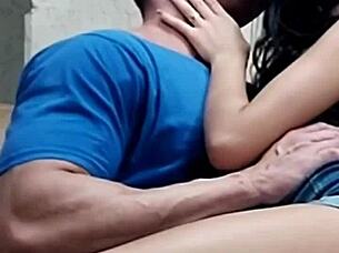 Look at this beautiful young latina couple. The cute girl is giving kisses to her athletic friend