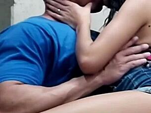 Look at this beautiful young latina couple. The cute girl is giving kisses to her athletic friend