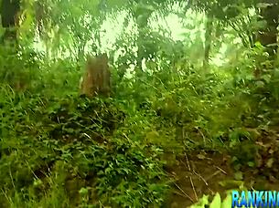 The Sexy Girl Enjoys A Walk In The Forest With Her Friends