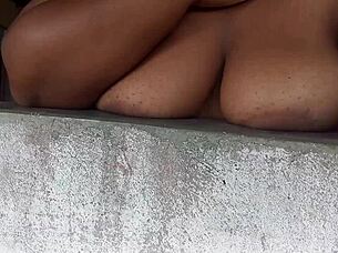 Latina slut flashes big tits from window to guys on street 😏