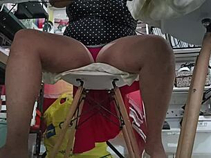 I watch my chubby sister-in-law doing her homework.