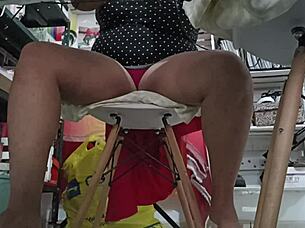 I watch my chubby sister-in-law doing her homework.