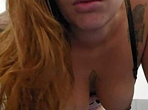 Hot redhead flashes her tits and pink pussy!