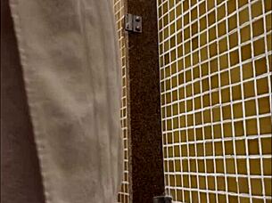 Someone's spying in the locker room shower, keeping an eye on the action.