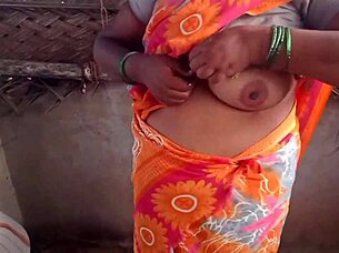 The appetizing housewife with big breasts shows herself in the village house
