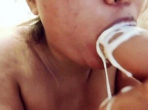 Sucking Messy Milk-Filled Dildo Up Close