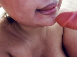 Sucking Messy Milk-Filled Dildo Up Close