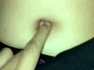 I peck her belly button as she rides me passionately