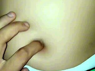 I peck her belly button as she rides me passionately