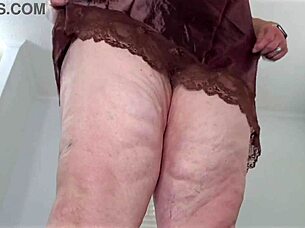 Mature lady in mini dress reveals her figure close up.