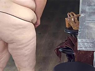 Mature lady in mini dress reveals her figure close up.