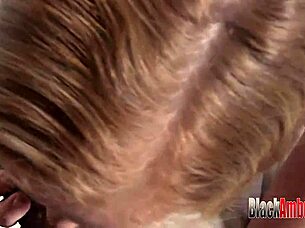 The red-haired girl with big breasts took a huge black cock