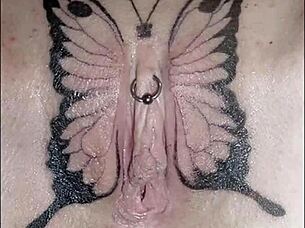 Crystal butterfly shows her tattooed pussy