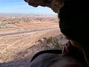 in a cave, she performs outdoor blowjob on monster cock, risking public exposure