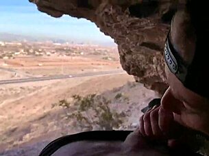 in a cave, she performs outdoor blowjob on monster cock, risking public exposure