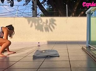 Brunette trains outdoors with shorts up her ass