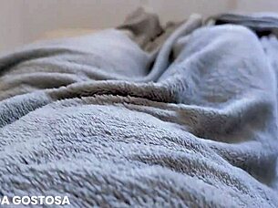 latina girl masturbates alone in bed until soaking her panties.