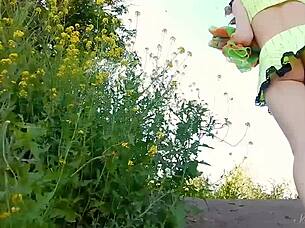 Spunky teen model strips naked during steamy outdoor photoshoot.