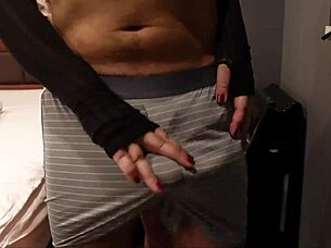 The perverted slut rubs the penis and balls to get it erect then slaps it hard