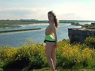 Spunky teen model strips naked during steamy outdoor photoshoot.