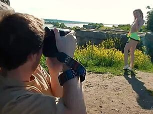 Spunky teen model strips naked during steamy outdoor photoshoot.