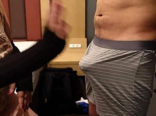 The perverted slut rubs the penis and balls to get it erect then slaps it hard