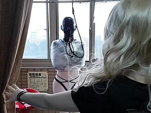 Thin rubber mask bondage play outdoors