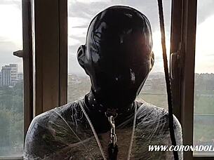 Thin rubber mask bondage play outdoors