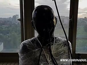 Thin rubber mask bondage play outdoors