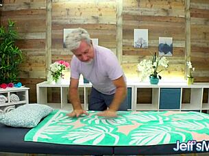 Masseur enjoys massaging the big redhead julie ginger