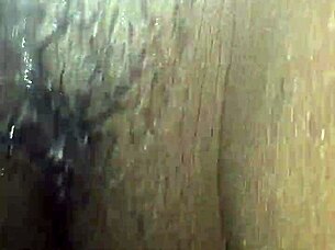 Ebony woman plays with wet pussy using vibrator and toys, teasing monster cock