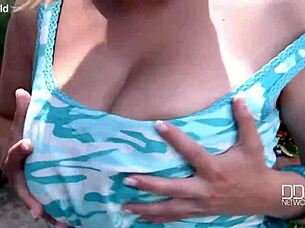 Eighteen year old Czech girl plays with huge tits outdoors.