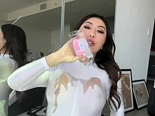 The hot asian chick oils her body and squirts during solo masturbation