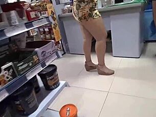 Manager and assistant handle blonde and brunette's payment.