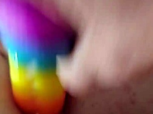 Fella stuck a whole rainbow dildo into tight anal hole