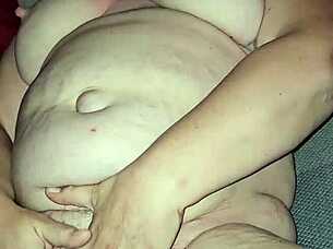 She stimulates herself until she reaches a strong climax