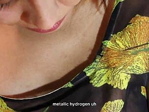 The hot teacher explains astronomy to her students in the classroom.